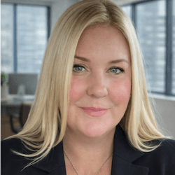 Professional woman in office with city view, promoting VerifyTreatment services.